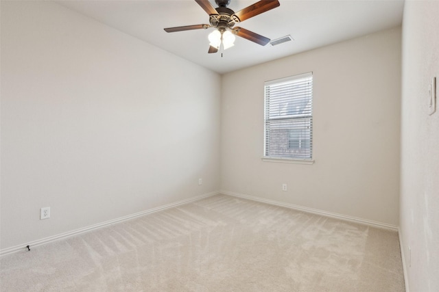 spare room with light colored carpet