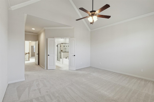 carpeted empty room featuring lofted ceiling, ornamental molding, and ceiling fan