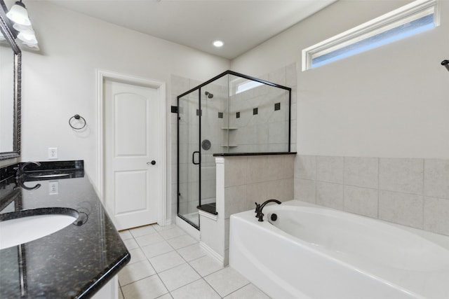 bathroom with separate shower and tub, tile patterned flooring, and vanity