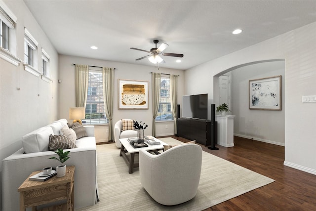 living room with ceiling fan and hardwood / wood-style floors