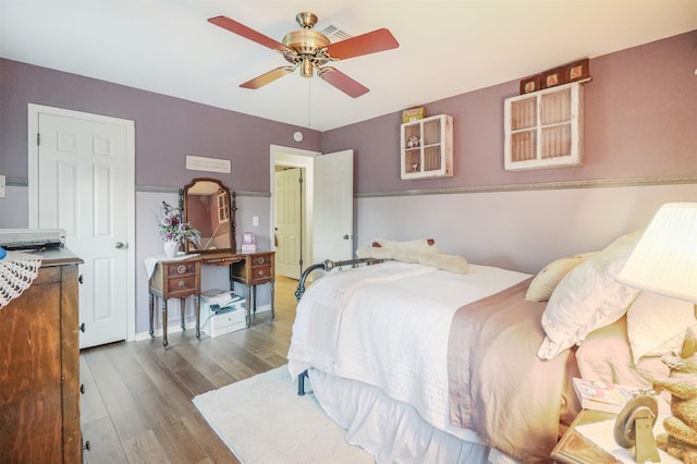 bedroom featuring ceiling fan and hardwood / wood-style floors