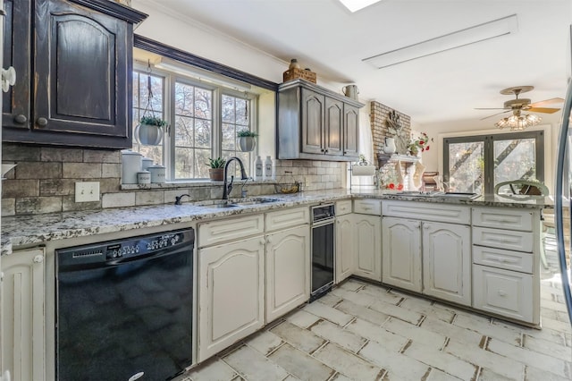 kitchen with backsplash, ceiling fan, dishwasher, and plenty of natural light