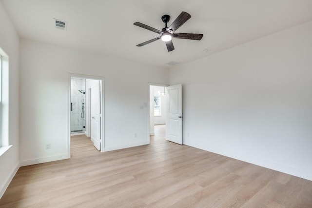 empty room featuring ceiling fan and light wood-type flooring