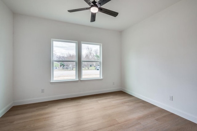 spare room with ceiling fan and light hardwood / wood-style flooring