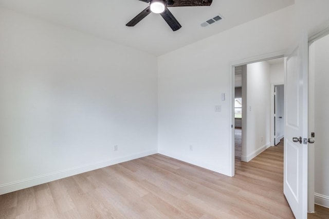 spare room with light hardwood / wood-style floors and ceiling fan