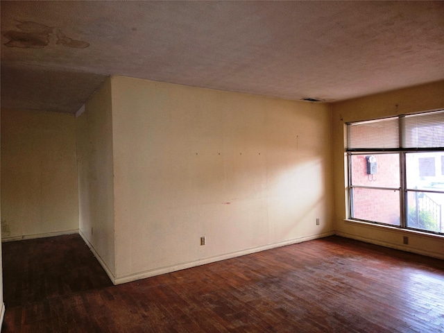 empty room with hardwood / wood-style floors