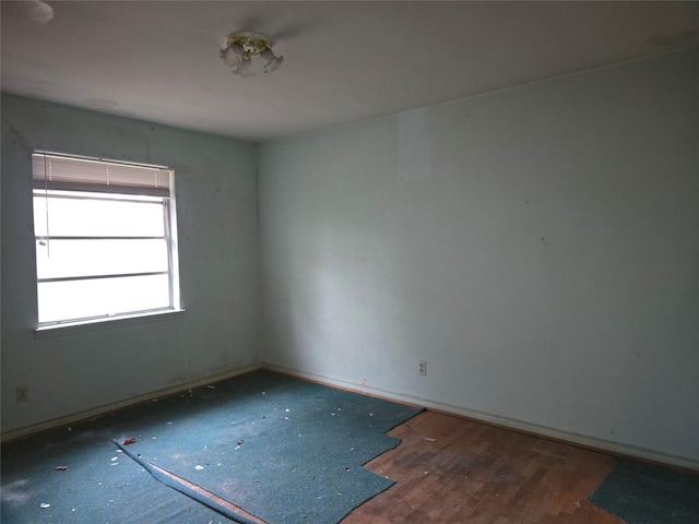 spare room with dark hardwood / wood-style floors