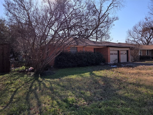 view of front facade with a front lawn and a garage