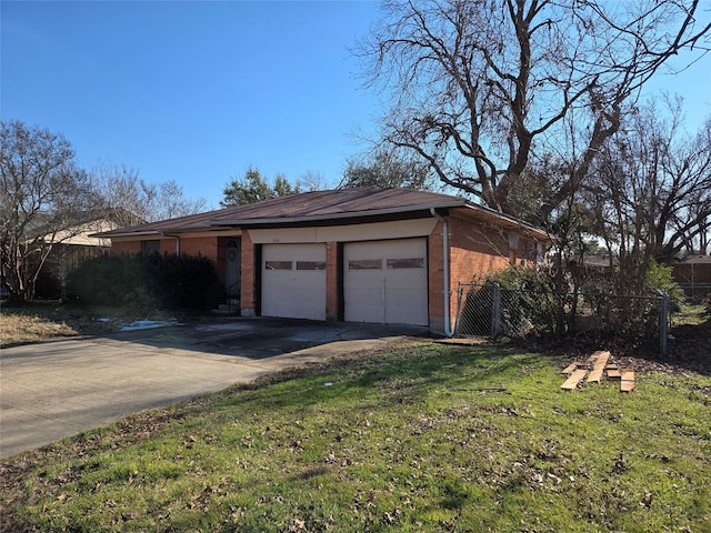 garage featuring a lawn