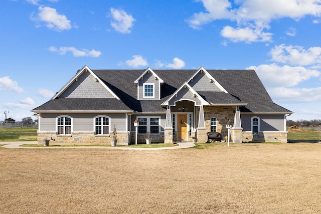 craftsman-style house with a front yard