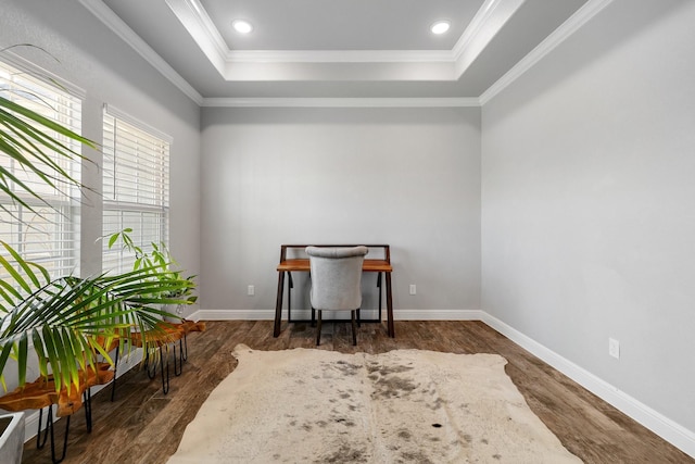 office with crown molding, dark hardwood / wood-style floors, and a tray ceiling