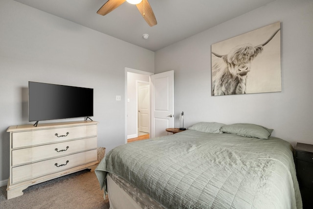 bedroom featuring ceiling fan and carpet