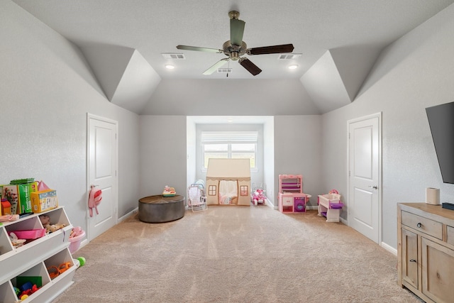 game room featuring ceiling fan, vaulted ceiling, and light colored carpet