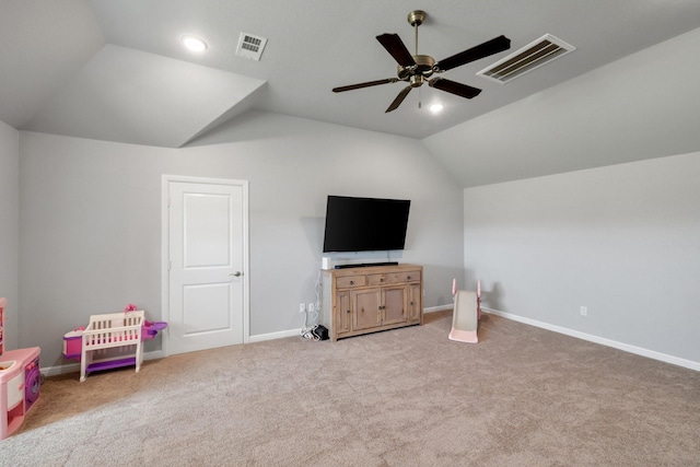 interior space featuring ceiling fan, light colored carpet, and vaulted ceiling