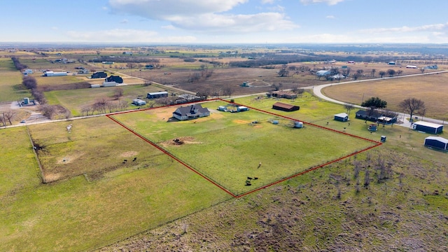 birds eye view of property featuring a rural view