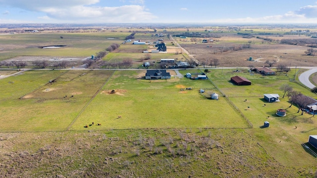 birds eye view of property featuring a rural view