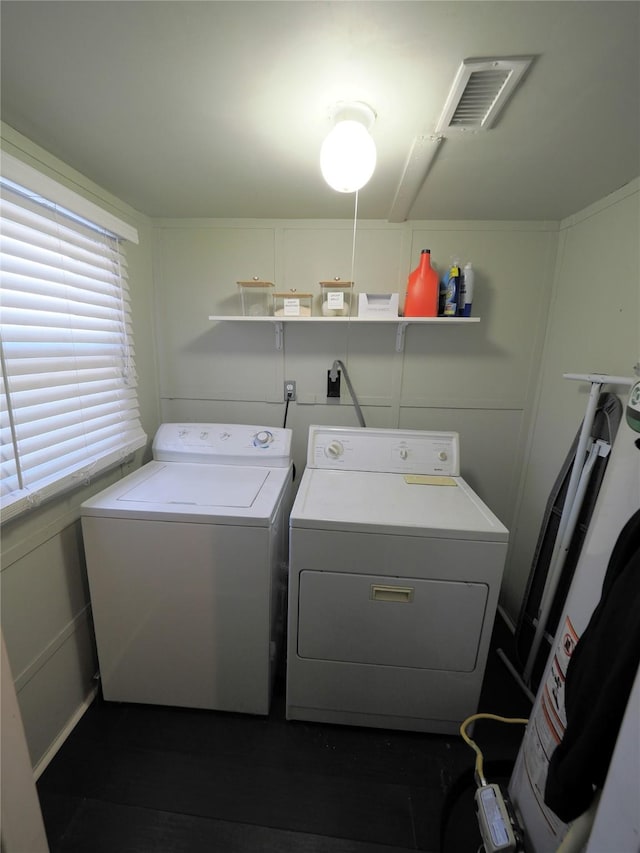 washroom featuring washer and clothes dryer