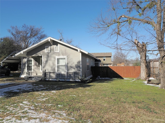 view of home's exterior with a lawn