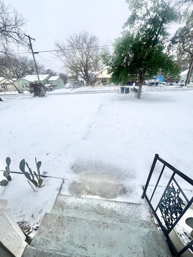 view of yard layered in snow