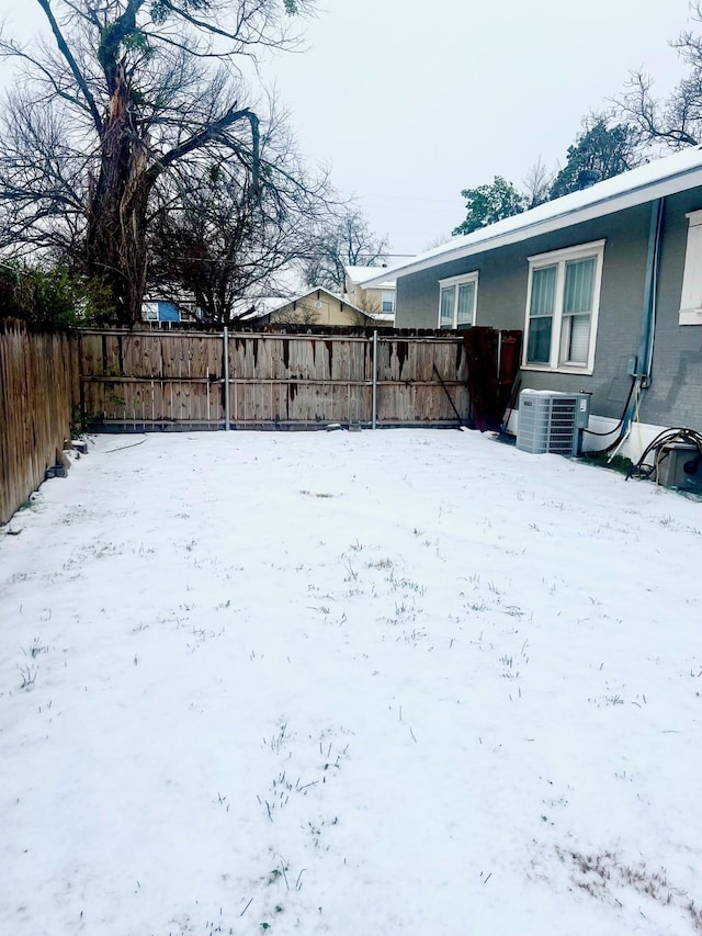 snowy yard with cooling unit