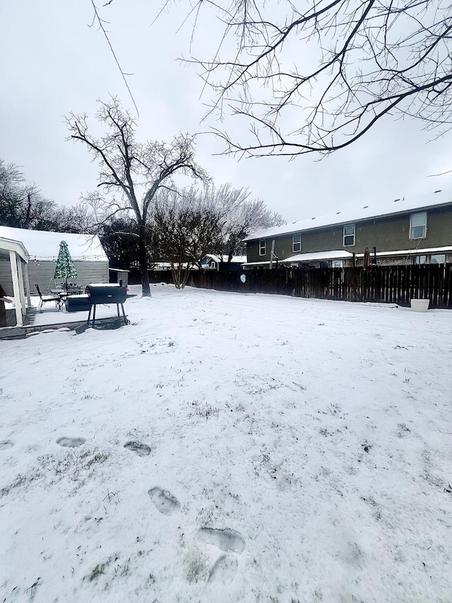 view of yard covered in snow