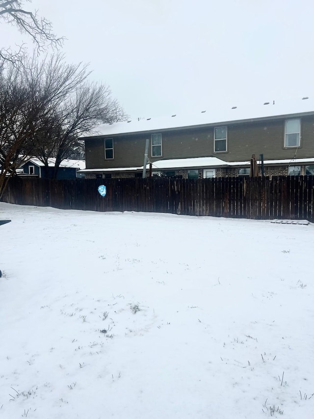 view of snow covered house