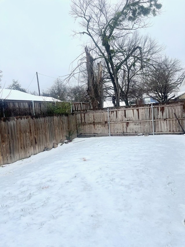 view of yard covered in snow