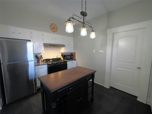 kitchen featuring decorative light fixtures, black appliances, decorative backsplash, a kitchen island, and white cabinets