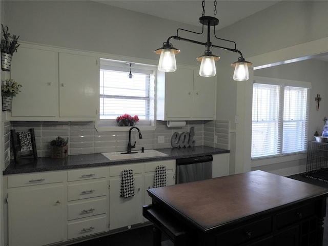 kitchen with dishwasher, hanging light fixtures, sink, white cabinetry, and backsplash