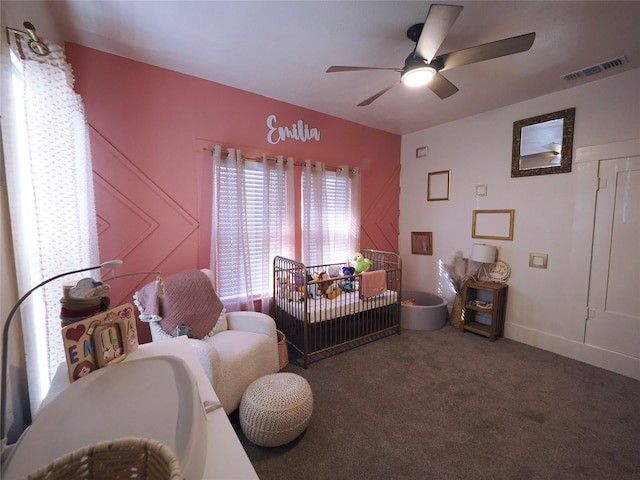 living area featuring ceiling fan and carpet