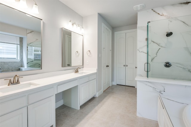 bathroom featuring tile patterned flooring, walk in shower, and vanity