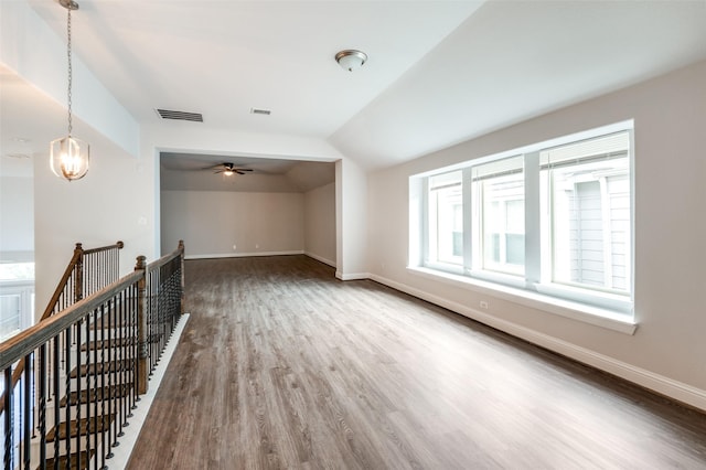 bonus room with hardwood / wood-style floors and lofted ceiling