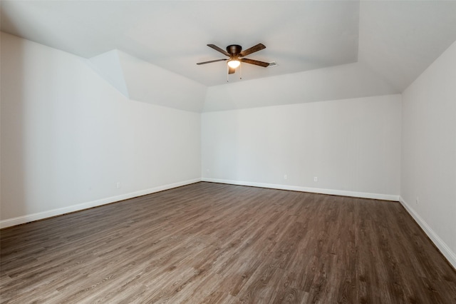 additional living space with vaulted ceiling, ceiling fan, and dark hardwood / wood-style flooring