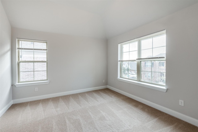 spare room with light colored carpet