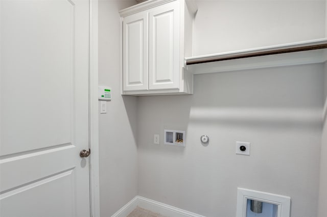 laundry room with cabinets, hookup for a washing machine, gas dryer hookup, and hookup for an electric dryer