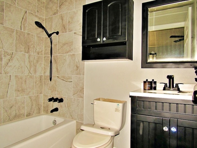 full bathroom with toilet, vanity, and tiled shower / bath combo