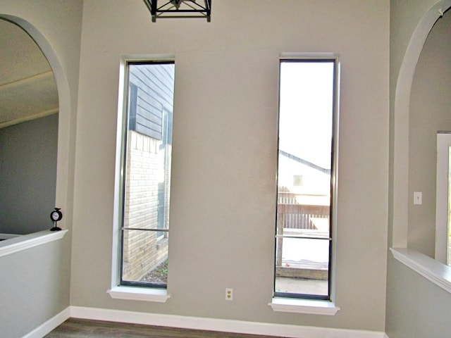 interior space with a healthy amount of sunlight and hardwood / wood-style flooring