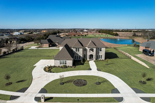 birds eye view of property featuring a water view