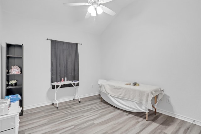 bedroom featuring high vaulted ceiling, ceiling fan, and light wood-type flooring