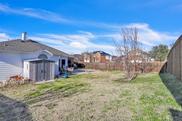 view of yard with a patio area and a shed