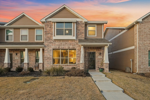 craftsman inspired home featuring a yard