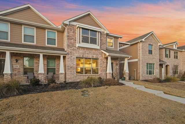 craftsman-style house with a yard