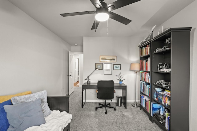 carpeted home office with ceiling fan