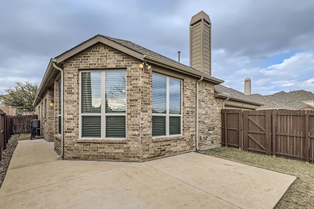 back of house with a patio area