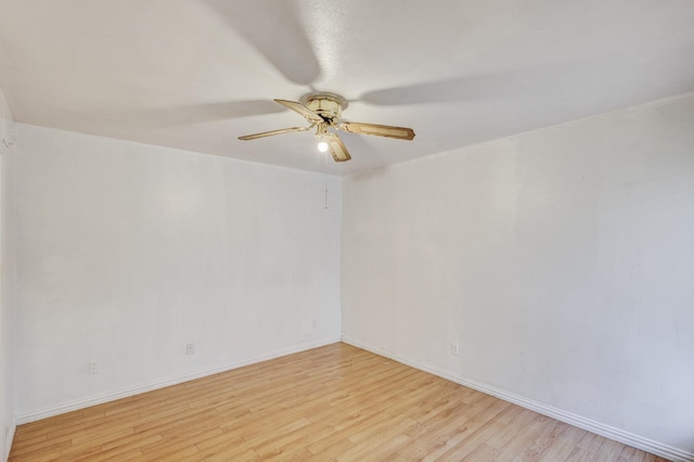 spare room featuring ceiling fan and light hardwood / wood-style floors