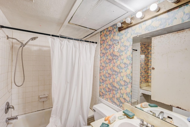 full bathroom with sink, toilet, a textured ceiling, and shower / bath combo