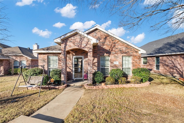 view of front of property with a front lawn