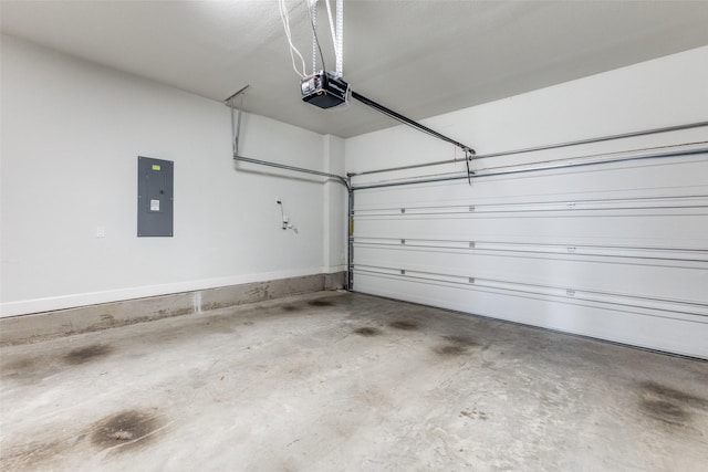 garage featuring electric panel and a garage door opener