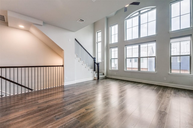 unfurnished living room featuring dark wood-type flooring