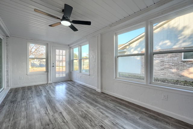 unfurnished sunroom with plenty of natural light and ceiling fan